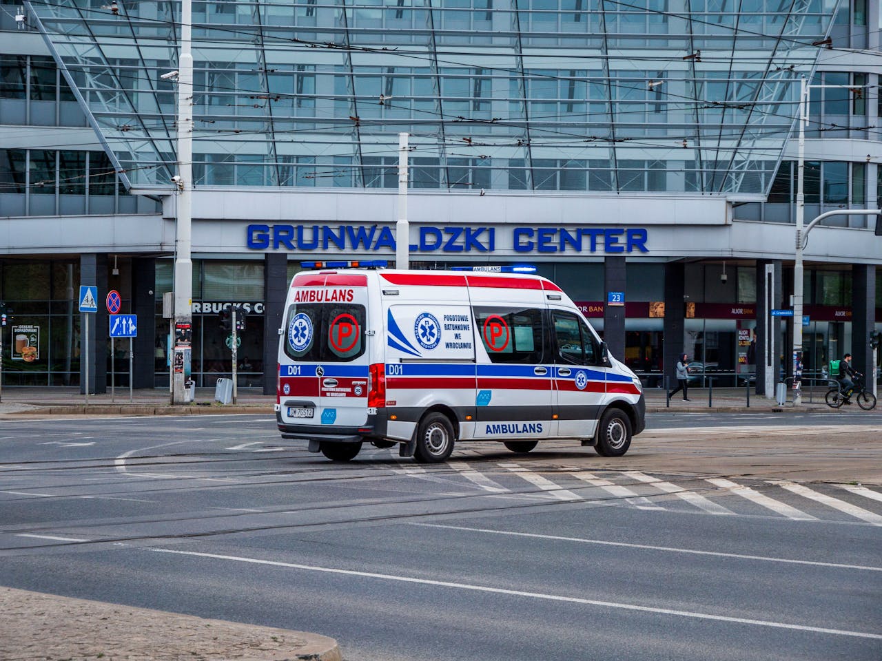 services-04 Ambulance driving on street near Grunwaldzki Center in Wrocław, Poland.